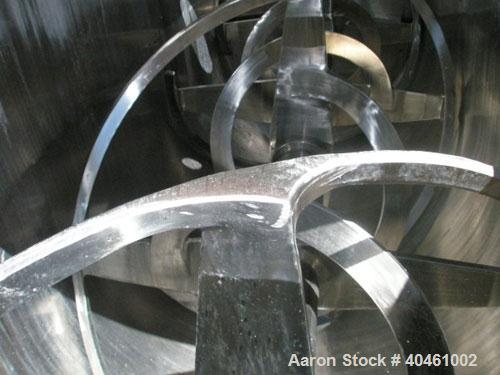 Used American Process double spiral ribbon blender, model DRB-120, 120 cubic foot working capacity, stainless steel. Non-jacketed trough 48" wide x 120" long x approximately 52" deep. 6" diameter sha...