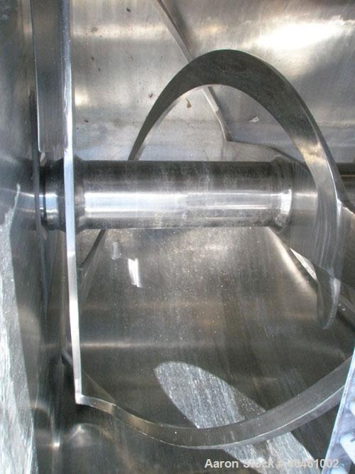 Used American Process double spiral ribbon blender, model DRB-120, 120 cubic foot working capacity, stainless steel. Non-jacketed trough 48" wide x 120" long x approximately 52" deep. 6" diameter sha...