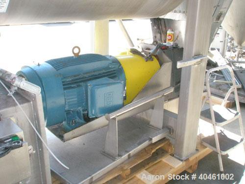 Used American Process double spiral ribbon blender, model DRB-120, 120 cubic foot working capacity, stainless steel. Non-jacketed trough 48" wide x 120" long x approximately 52" deep. 6" diameter sha...