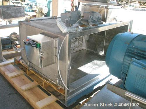 Used American Process double spiral ribbon blender, model DRB-120, 120 cubic foot working capacity, stainless steel. Non-jacketed trough 48" wide x 120" long x approximately 52" deep. 6" diameter sha...