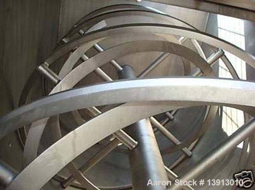 Used Hayes & Stolz Double Ribbon Blender. Manufactured 1998. 260 cubic foot, food grade stainless steel, 40 hp drive, 10 rpm at ribbon, covered top with (2) 7" and (2) 25" square inlets. Approximatel...