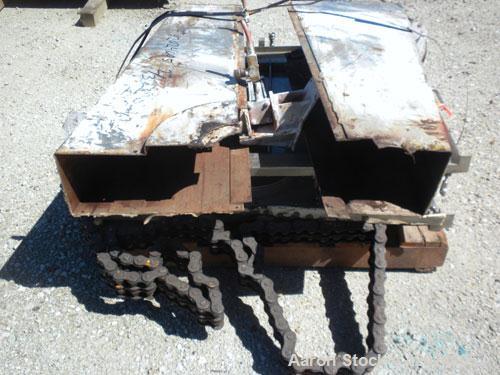 Used J.H. Day Double Spiral Ribbon Blender, Model G, 62.5 cubic feet working capacity (69 total), 304 stainless steel. Non-jacketed trough 36" wide x96" long x approximately 39" deep. 4" Diameter sha...