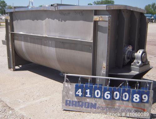 Used J.H. Day Double Spiral Ribbon Blender, 80 cubic feet working capacity, 93 total, 304 stainless steel. Non-jacketed trough 40" wide x 96" long x approximately 47" deep. 4" diameter shaft, inner r...