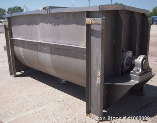 Used J.H. Day Double Spiral Ribbon Blender, 80 cubic feet working capacity, 93 total, 304 stainless steel. Non-jacketed trough 40" wide x 96" long x approximately 47" deep. 4" diameter shaft, inner r...