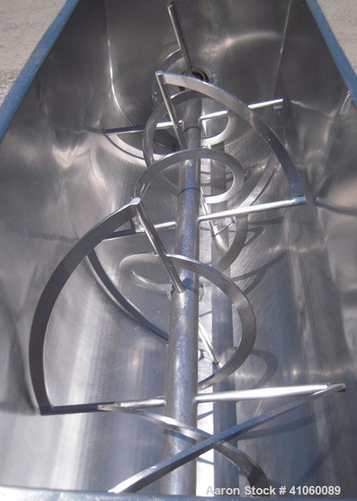 Used J.H. Day Double Spiral Ribbon Blender, 80 cubic feet working capacity, 93 total, 304 stainless steel. Non-jacketed trough 40" wide x 96" long x approximately 47" deep. 4" diameter shaft, inner r...