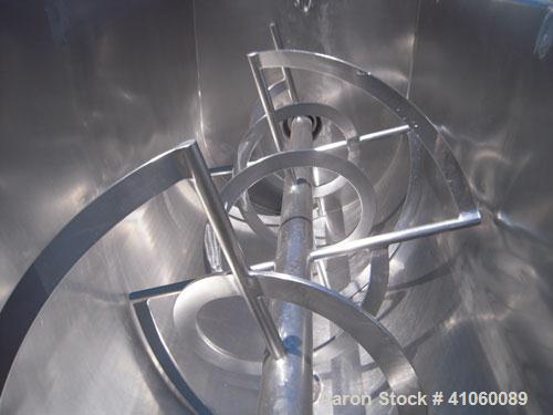 Used J.H. Day Double Spiral Ribbon Blender, 80 cubic feet working capacity, 93 total, 304 stainless steel. Non-jacketed trough 40" wide x 96" long x approximately 47" deep. 4" diameter shaft, inner r...