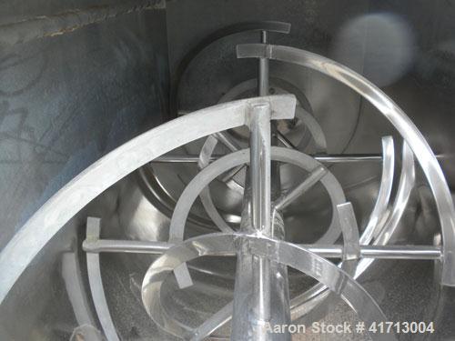 Used J.H. Day Double Spiral Ribbon Blender, 120 cubic feet working capacity. 304 stainless steel clad; carbon steel outside.  Non-jacketed trough 44" wide x 120" long x approximately 52" deep. 4-1/2"...