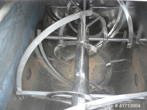 Used J.H. Day Double Spiral Ribbon Blender, 120 cubic feet working capacity. 304 stainless steel clad; carbon steel outside.  Non-jacketed trough 44" wide x 120" long x approximately 52" deep. 4-1/2"...