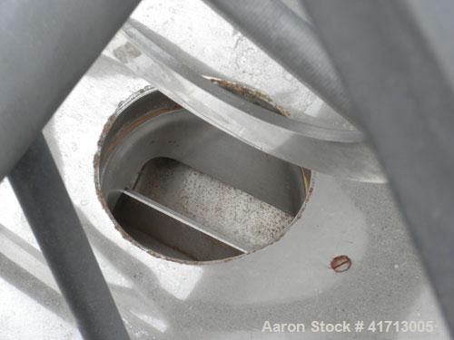 Used J.H. Day Double Spiral Ribbon Blender, 79 cubic root working capacity. 304 stainless steel clad; carbon steel outside.  Non-jacketed trough 40" wide x 96" long x approximately 47" deep. 4-1/4" d...