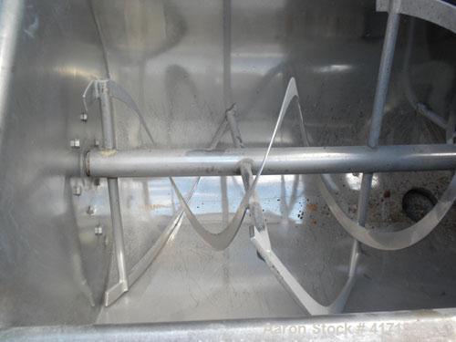 Used J.H. Day Double Spiral Ribbon Blender, 17.8 cubic foot working capacity. 304 stainless steel clad; carbon steel outside.  Non-jacketed trough 24" wide x 60" long x approximately 26" deep. 2" dia...