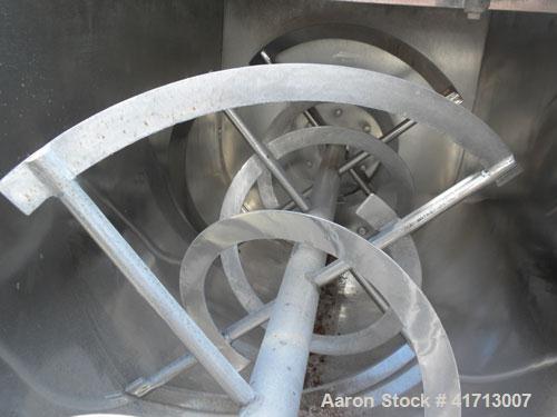 Used J.H. Day Double Spiral Ribbon Blender, 17.8 cubic foot working capacity. 304 stainless steel clad; carbon steel outside.  Non-jacketed trough 24" wide x 60" long x approximately 26" deep. 2" dia...
