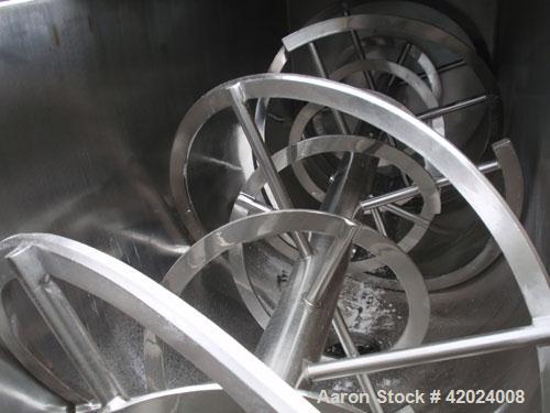 Used J.H. Day Double Spiral Ribbon Blender, 100 cubic feet working capacity (115 total), 304 stainless steel. Non-jacketed trough 40" wide x 120" long. 10" center bottom outlet. Driven by a 60 hp, 3/...