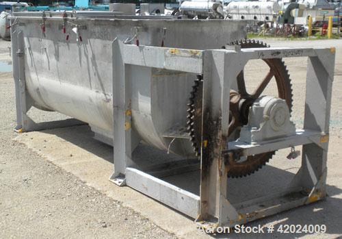Used J.H. Day Double Spiral Ribbon Blender, 100 Cubic Feet Working Capacity (115 Total), 304 Stainless Steel. Non-Jacketed trough 40" wide x 120" long x approximately 48" deep. 5" Diameter shaft, inn...