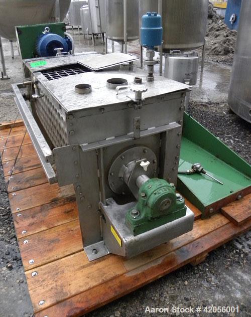 Used J.H. Day Paddle Mixer, 10.8 cubic feet working capacity, 12.5 total, 304 stainless steel. Dimple jacketed trough 21" wide x 48" long x approximately 24" deep, rated 125 psi at 353 deg F. 3" diam...