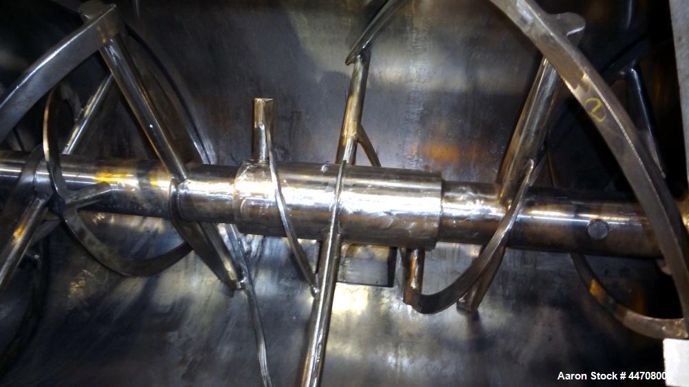 Used J.H. Day Double Spiral Ribbon Blender, 185 cubic feet working capacity, 304 stainless steel. Non-jacketed trough 50" wide x 144" long x approximately 59" deep. 6" Diameter shaft, inner ribbon 2"...