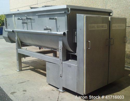 Used Karl Schnell Twin Shaft Ribbon Mixer. All stainless steel, capacity 1190 gallons (4,500 liters). Bowl dimensions 5'3" long x 9'5" wide x 3'3" deep (1600 mm long x 2900 mm wide x 1000 mm deep). (...