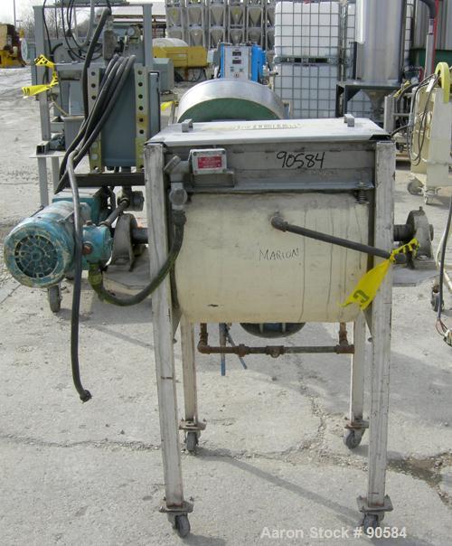 Used:Marion paddle mixer, model 1101, 4 cubic feet, 304 stainless steel.Dimpled jacketed trough 18" wide x 24" long x 21" deep, no rating. 2 3/8" diameter shaft with 4 bollt on paddles, 1 1/8" diamet...