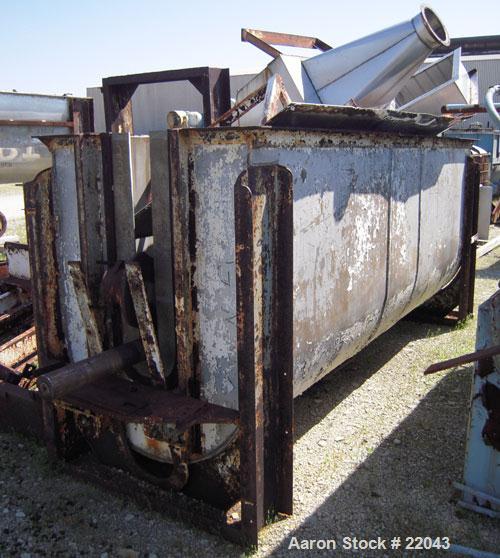 Used Ribbon Blender, 143 Cubic Feet, 304 Stainless Steel. Non-jacketed trough 44" wide x 144" long x approximately 59" deep. 4" diameter stainless steel clad shaft with partial ribbons and posts. 1 p...