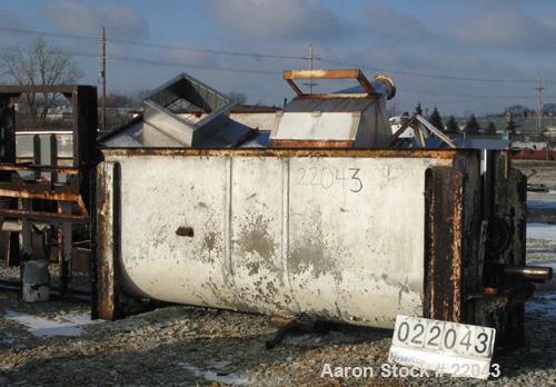Used Ribbon Blender, 143 Cubic Feet, 304 Stainless Steel. Non-jacketed trough 44" wide x 144" long x approximately 59" deep. 4" diameter stainless steel clad shaft with partial ribbons and posts. 1 p...