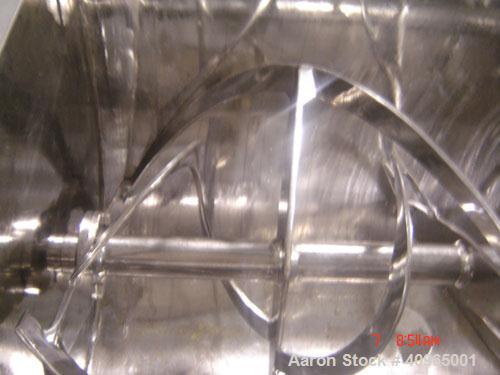 Used Ribbon Blender, 25 Cubic Feet, Stainless Steel. Non-jacketed trough 29" wide x 58" long x 32" deep, 6" center bottom outlet. Stainless steel split packing glands, split two piece cover and safet...