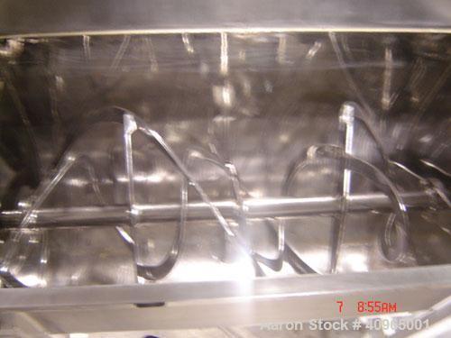 Used Ribbon Blender, 25 Cubic Feet, Stainless Steel. Non-jacketed trough 29" wide x 58" long x 32" deep, 6" center bottom outlet. Stainless steel split packing glands, split two piece cover and safet...