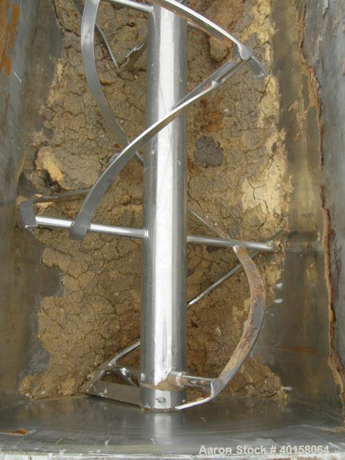 Used Paul O Abbe #10 Double Spiral Ribbon Blender, 40 cubic feet working capacity, 304 stainless steel. Carbon steel jacketed trough 30'' wide x 88'' x approximately 34" deep, rated 14 psi. 5" diamet...