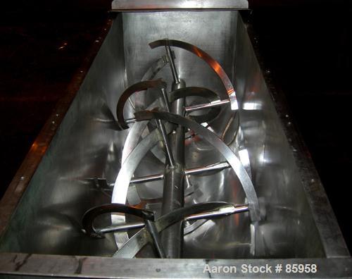 USED: Paul O Abbe double spiral ribbon blender, 8.3 cubic feet working capacity, 304 stainless steel. Non-jacketed trough 50" long x 18" wide x approximately 22" deep. 2-1/2" diameter shaft. Inner ri...