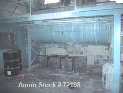 USED: Readco ribbon blender, 144 cubic foot working capacity, carbon steel. 44" wide x 144" long jacketed trough. Double ribbon, outboard roller bearings, packing glands. Chain driven by a 30 hp gear...