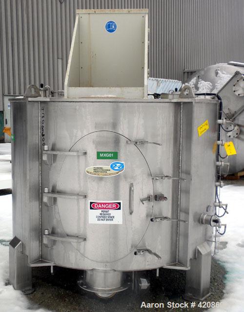 Used Ruberg Vertical Single Shaft Mixer, 88.3 cubic feet (25-2500 liter), model VM2500, 316L stainless steel. Non-jacketed chamber approximately 74" diameter x 50" deep, flat top and bottom. 6" diame...