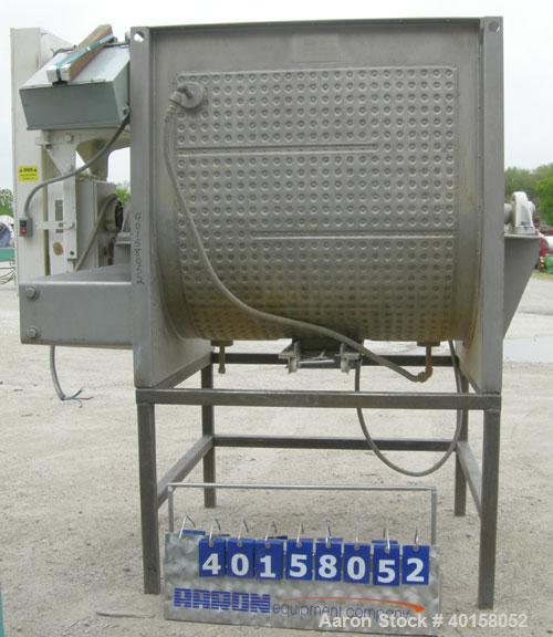 Used Scott Equipment Co double spiral ribbon blender, approximately 56 cubic feet working capacity, 304 stainless steel. Dimpled jacketed trough 48" wide x 54" long x approximately 54" deep, rated 30...