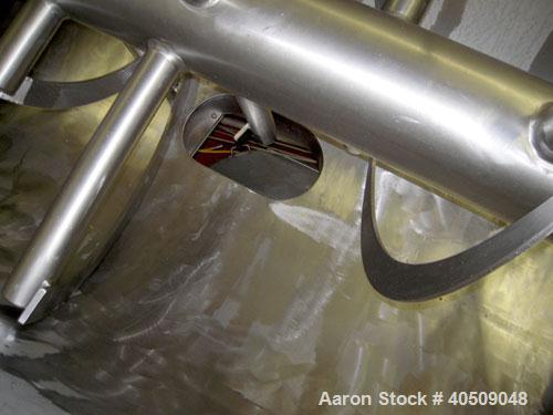Used Sprout Waldron Double Spiral Ribbon Blender, Model 14,000#, 267 cubic feet working capacity, stainless steel. Non- jacketed trough 60" wide x 144" long x approximately 65" deep. 10" diameter sha...