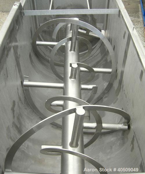 Used Sprout Waldron Double Spiral Ribbon Blender, Model 14,000#, 267 cubic feet working capacity, 304 stainless steel. Non- jacketed trough 60" wide x 144" long x approximately 65" deep. 10" diameter...