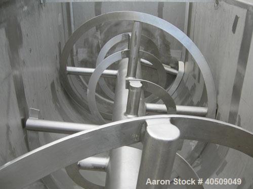 Used Sprout Waldron Double Spiral Ribbon Blender, Model 14,000#, 267 cubic feet working capacity, 304 stainless steel. Non- jacketed trough 60" wide x 144" long x approximately 65" deep. 10" diameter...