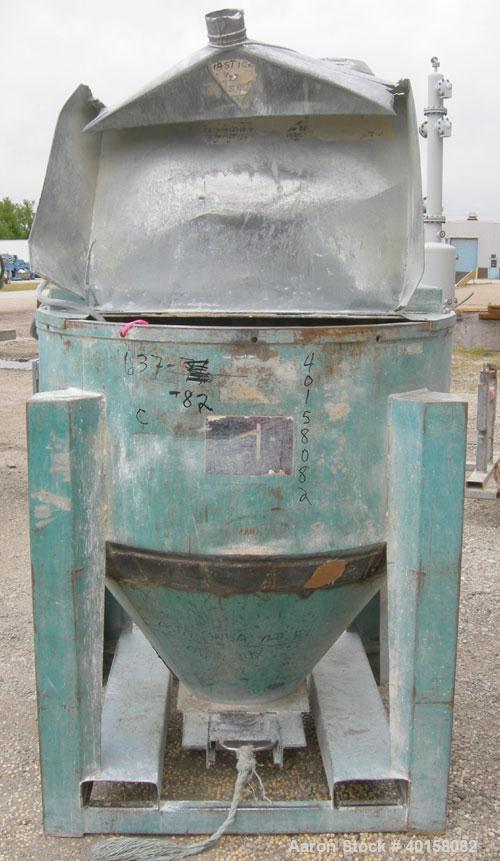 Used Universal Dynamics Vertical Ribbon Mixer, approximately 26 cubic feet, model 65-2000, carbon steel. 48" diameter x 22" straight side x 30" coned bottom. 3" diameter shaft, single ribbon 1 3/4" w...