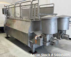 Used Approximately 140 cuft / 1100 Gallon capacity Dual Shaft Ribbon Blender. Stainless steel. Dimple Jacket. Bottom Dischar...