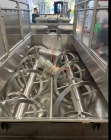 Used Approximately 140 cuft / 1100 Gallon capacity Dual Shaft Ribbon Blender. Stainless steel. Dimple Jacket. Bottom Discharge: (2) 10