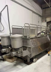 Used Approximately 140 cuft / 1100 Gallon capacity Dual Shaft Ribbon Blender. Stainless steel. Dimple Jacket. Bottom Discharge: (2) 10