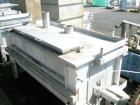 Used Aaron Process double spiral ribbon blender, 80 cubic feet working capacity, stainless steel. Non-jacketed trough 40