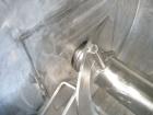 Used Aaron Process double spiral ribbon blender, 80 cubic feet working capacity, stainless steel. Non-jacketed trough 40