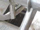 Used J.H. Day Double Spiral Ribbon Blender, 185 cubic feet working capacity, 304 stainless steel. Non-jacketed trough 50