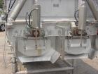 USED: Mepaco model 170 MD twin screw mixer/blender. 5,000 lb or 136 cu ft capacity. Equipped with pneumatically operated end discharge. The mix tub is 64