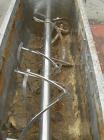 Used Paul O Abbe #10 Double Spiral Ribbon Blender, 40 cubic feet working capacity, 304 stainless steel. Carbon steel jacketed trough 30'' wide x 88'' x approximately 34