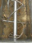 Used Paul O Abbe #10 Double Spiral Ribbon Blender, 40 cubic feet working capacity, 304 stainless steel. Carbon steel jacketed trough 30'' wide x 88'' x approximately 34