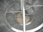 Used Universal Dynamics Vertical Ribbon Mixer, approximately 26 cubic feet, model 65-2000, carbon steel. 48