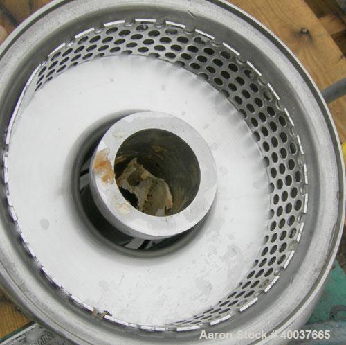 Used Tri Clover Tri Blender, Model F2116MD-B40, 316 Stainless Steel. Approximately 4-1/2" diameter x 1-1/2" high impeller. Driven by a 2 1/2 hp, 3/60/230/460 volt, 3600 rpm motor. 2" tri clamp top in...