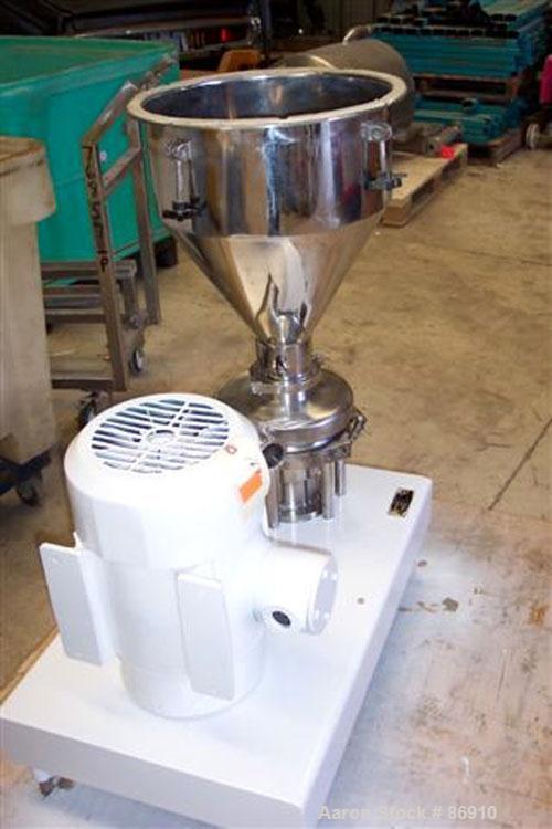 Used Tri Clover Tri-Blender, Model F3218MD-B40, 316 Stainless Steel. Approximate 7.5" diameter impeller. 2-1/2" NPT powder inlet, 4" tri-clamp inlet with hopper, 2" tri-clamp liquid outlet. Dry ingre...