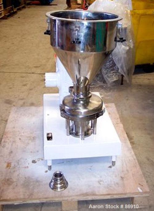 Used Tri Clover Tri-Blender, Model F3218MD-B40, 316 Stainless Steel. Approximate 7.5" diameter impeller. 2-1/2" NPT powder inlet, 4" tri-clamp inlet with hopper, 2" tri-clamp liquid outlet. Dry ingre...