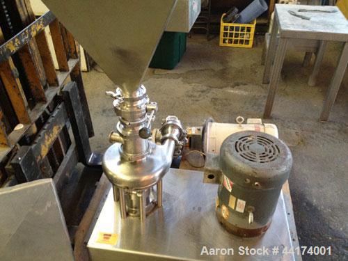 Used Tri-Clover Tri-Blender, Model F3218, 316 Stainless Steel. Approximate 7.5" diameter impeller. 1-1/2" Tri-clamp liquid inlet, 3" tri-clamp powder inlet with 304 stainless steel hopper, 2" tri-cla...