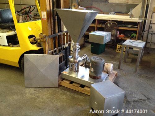 Used Tri-Clover Tri-Blender, Model F3218, 316 Stainless Steel. Approximate 7.5" diameter impeller. 1-1/2" Tri-clamp liquid inlet, 3" tri-clamp powder inlet with 304 stainless steel hopper, 2" tri-cla...