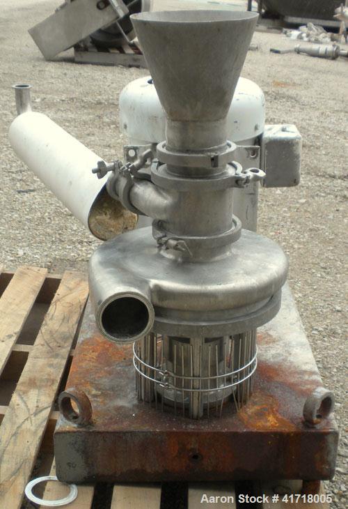 Used Tri-Clover Tri-Blender, Model F4329, 316 stainless steel. Approximate 9 1/2'' diameter impeller, 4" tri-clamp powder inlet with hopper, 1-1/2" tri-clamp liquid inlet, 3" tri-clamp liquid outlet....